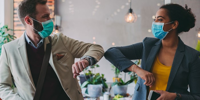 Business People Greeting During COVID 19 Pandemic, Elbow Bump
