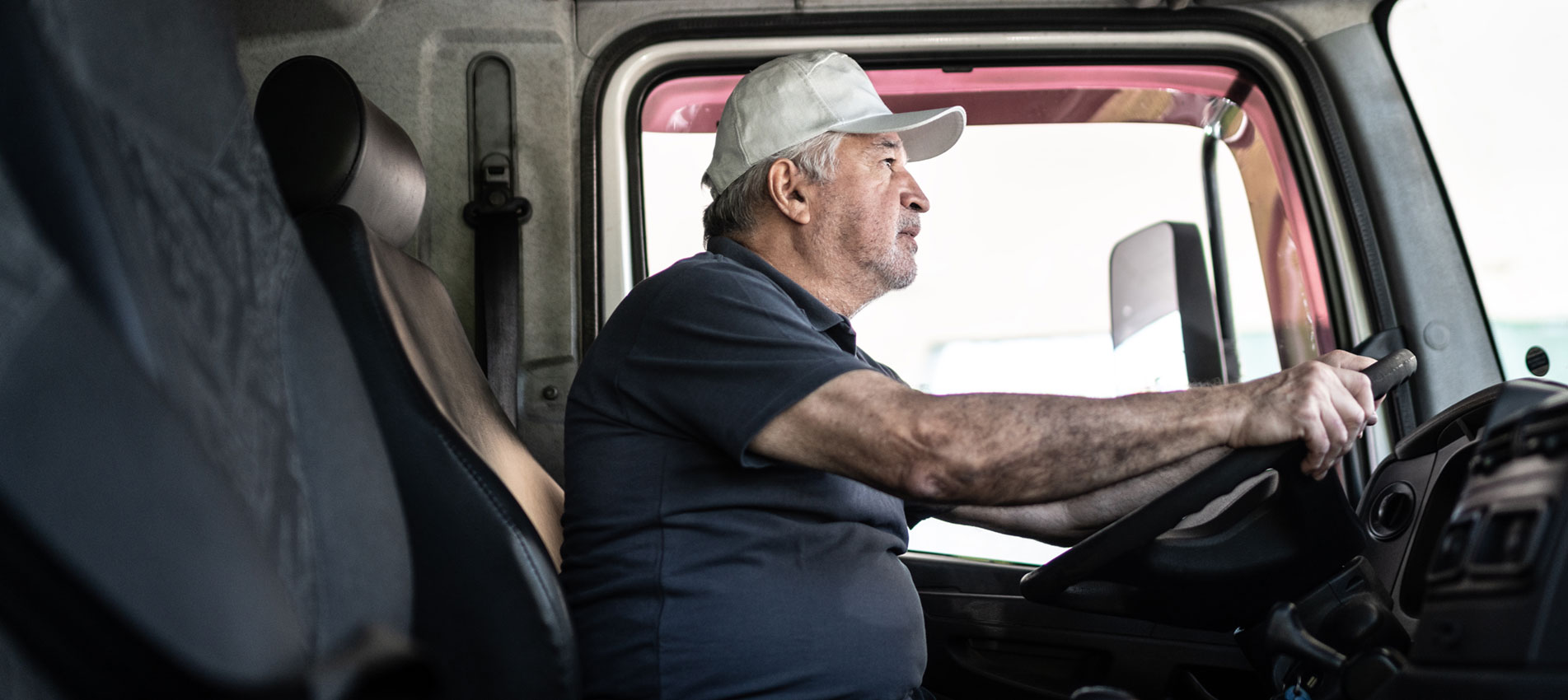 Truck Driver At The Wheel