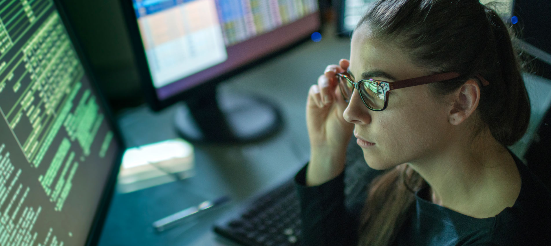 Woman Surrounded By Monitors