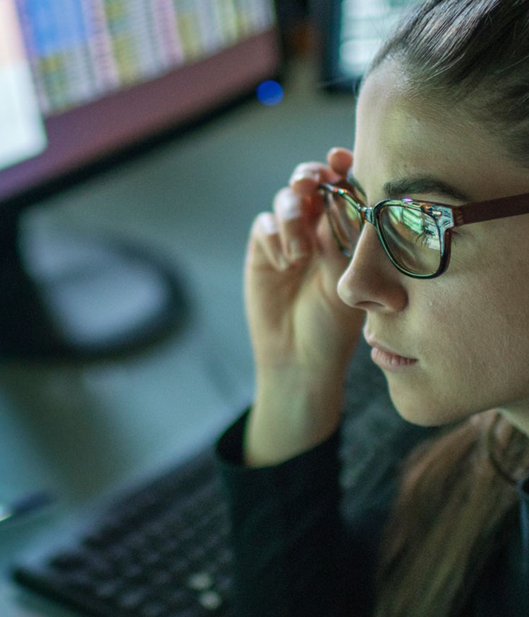 Woman Surrounded By Monitors