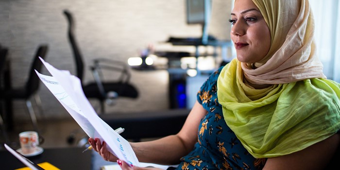 Woman Looking At Online Investment