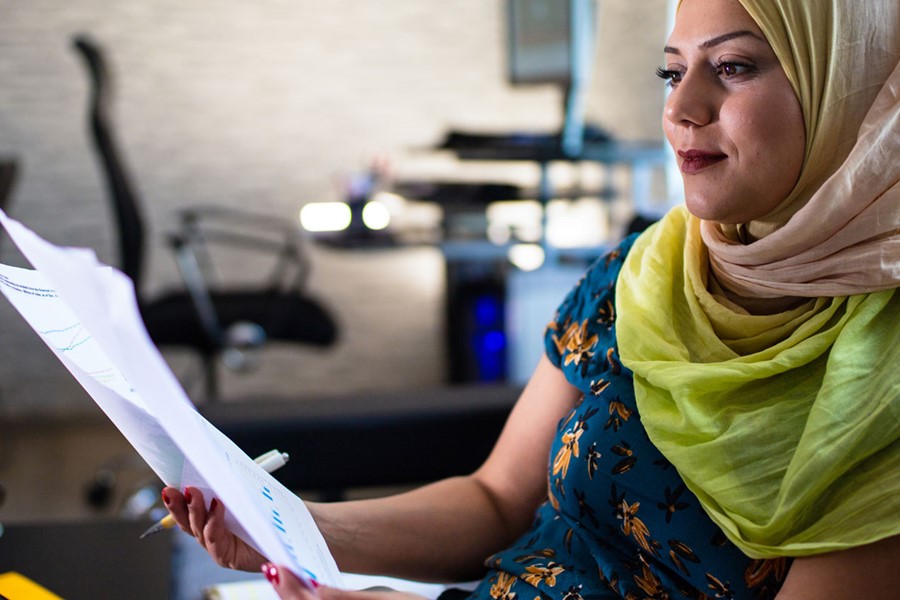 Woman Looking At Online Investment