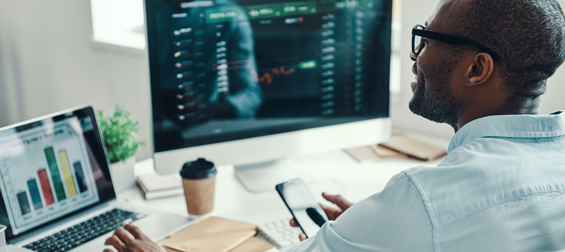 Man On Computer Looking At Data