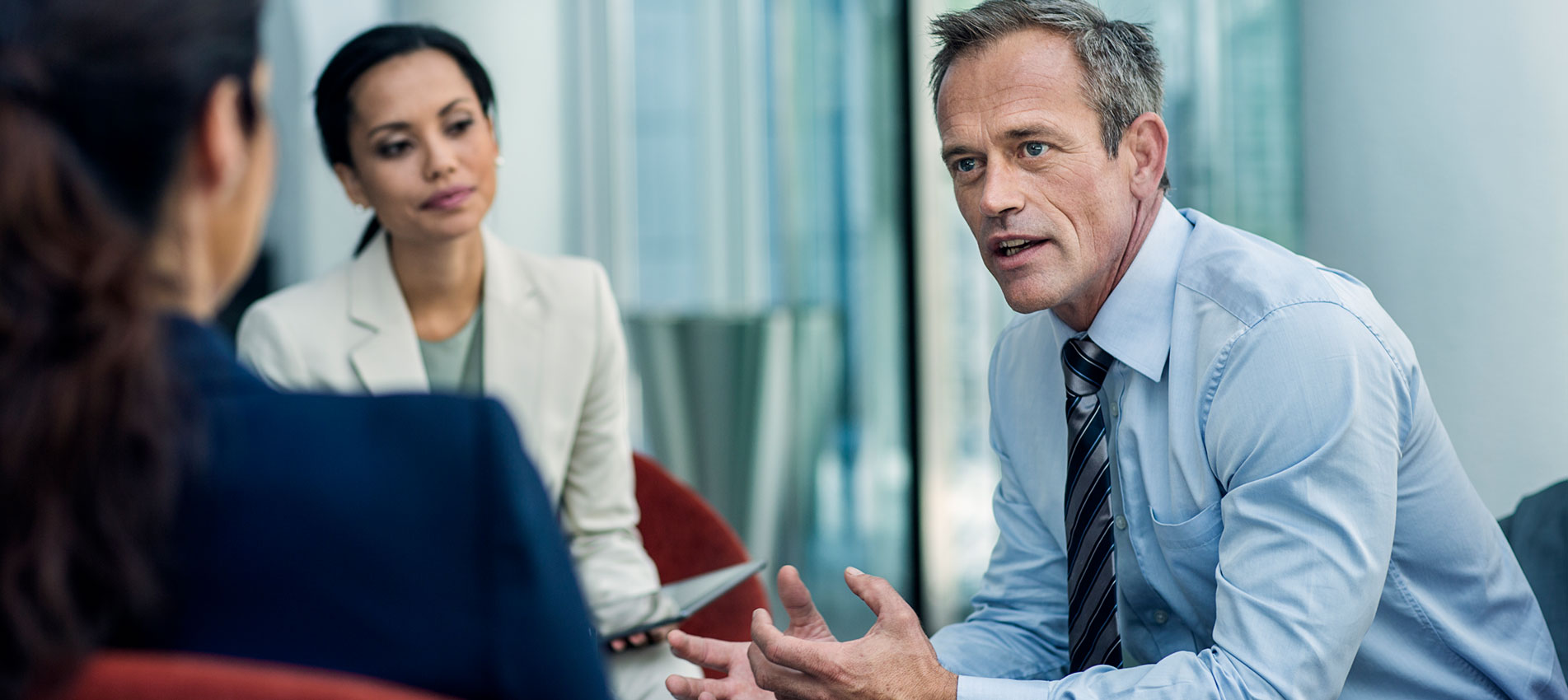 Businessman Discussing Strategy With Colleagues