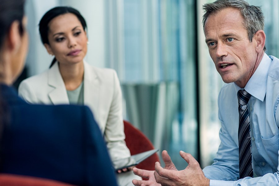 Businessman Discussing Strategy With Colleagues