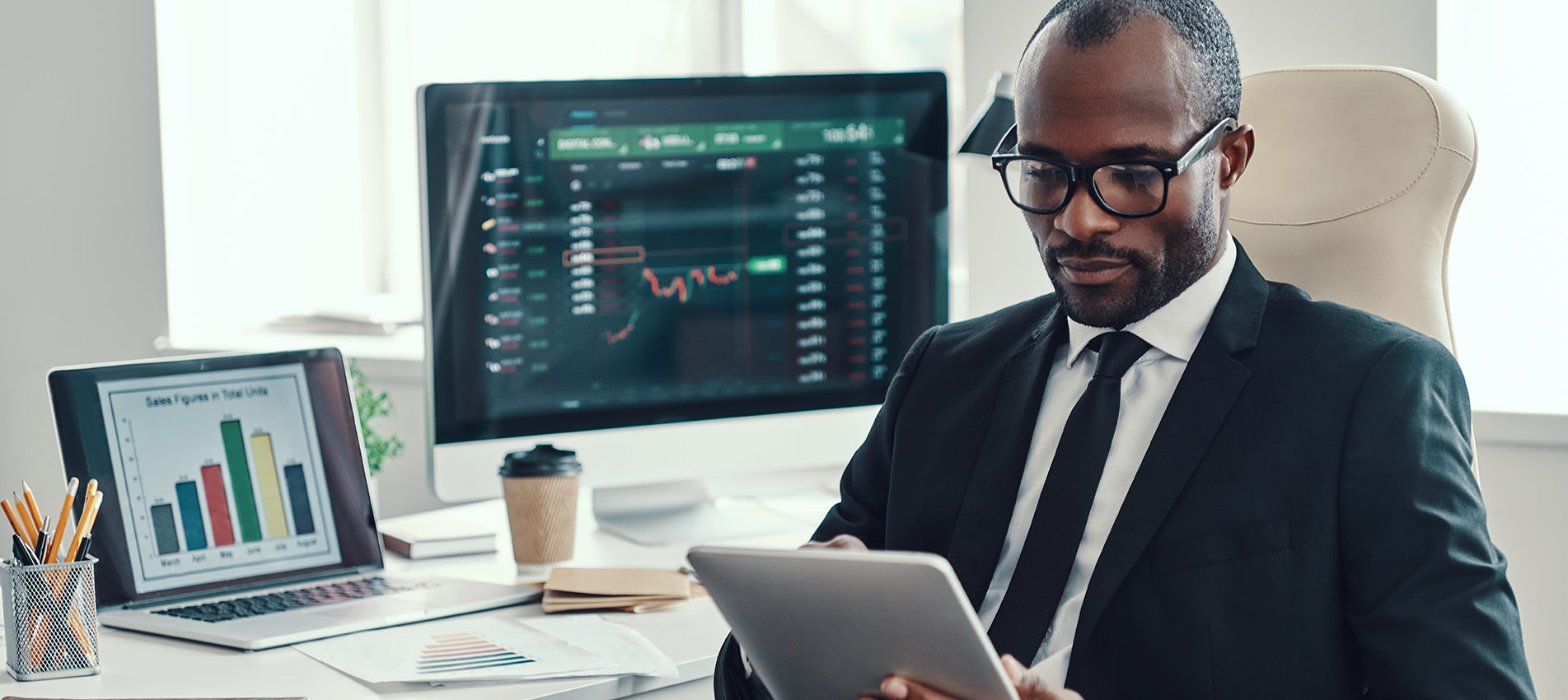Young African Man In Formalwear Using Modern Technologies While Working In The Office