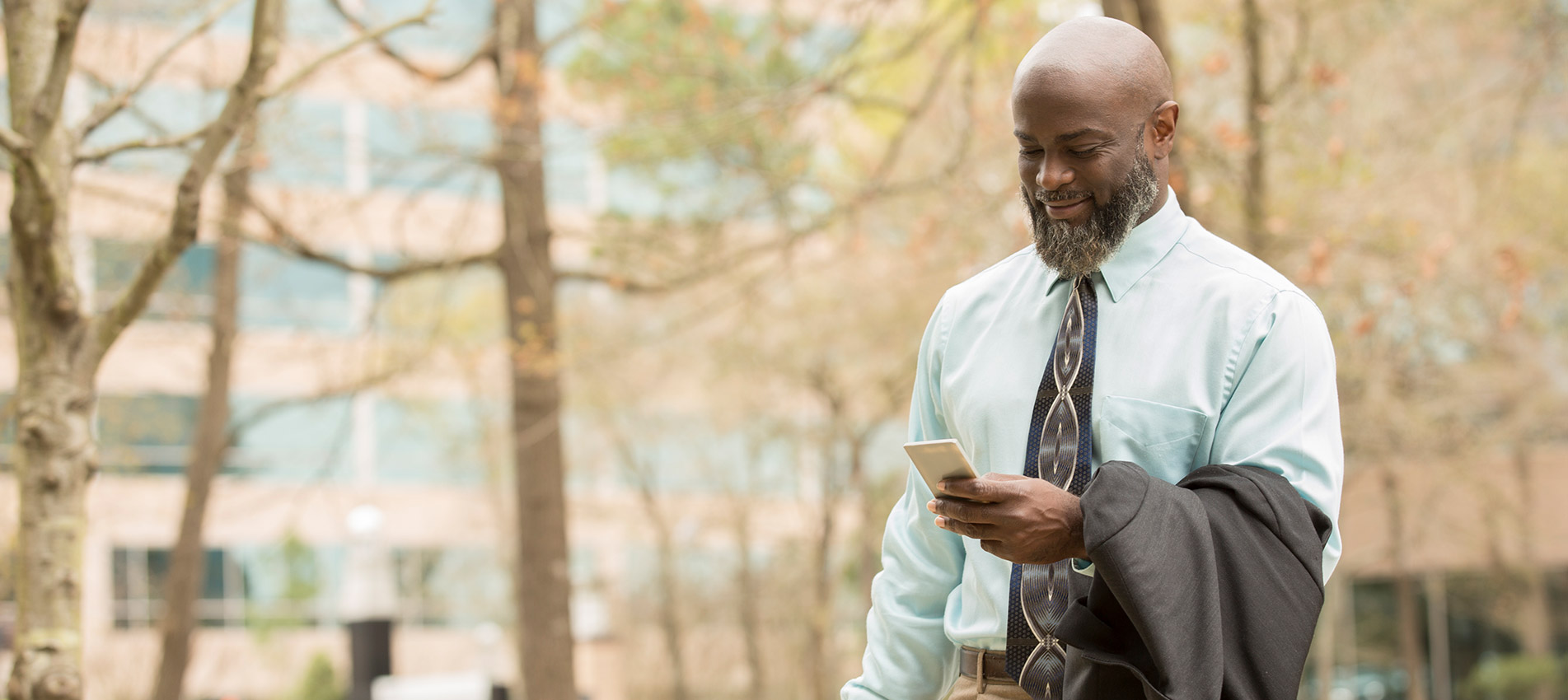 African Descent Business Man On The Go In Downtown City