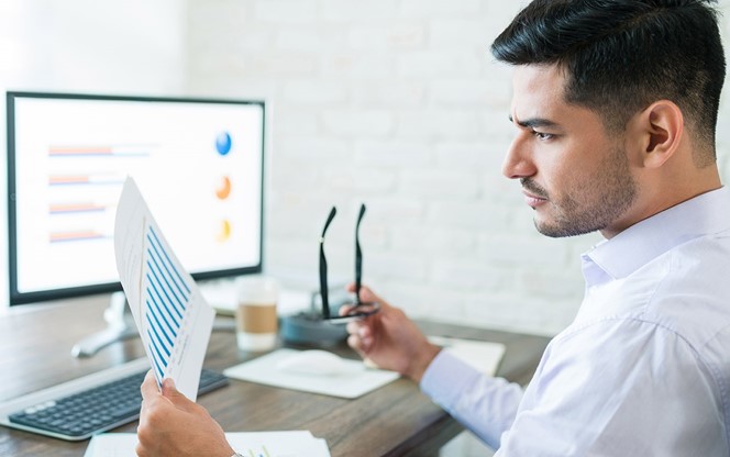 Man Examining Data