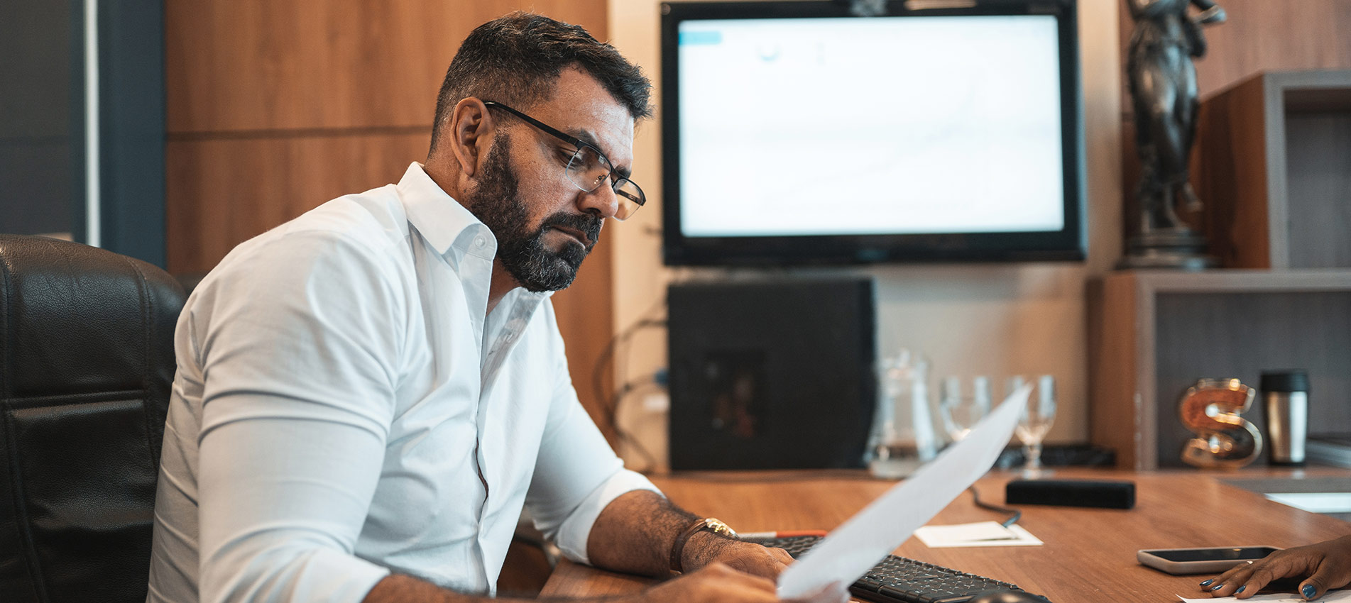 Mature Man Using Laptop In Office