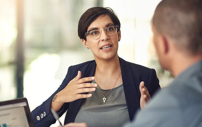 Colleagues Having A Discussion In A Boardroom