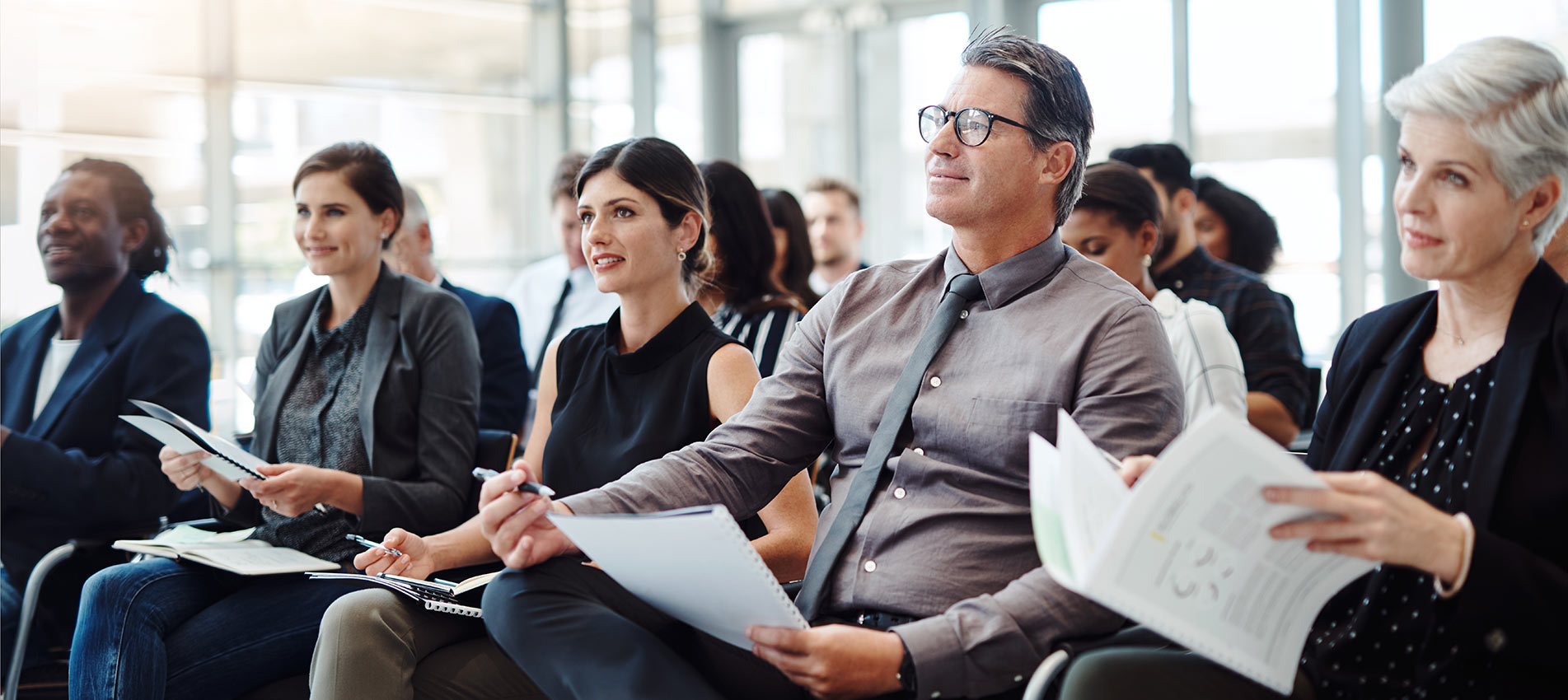Group Of Businesspeople Attending A Conference