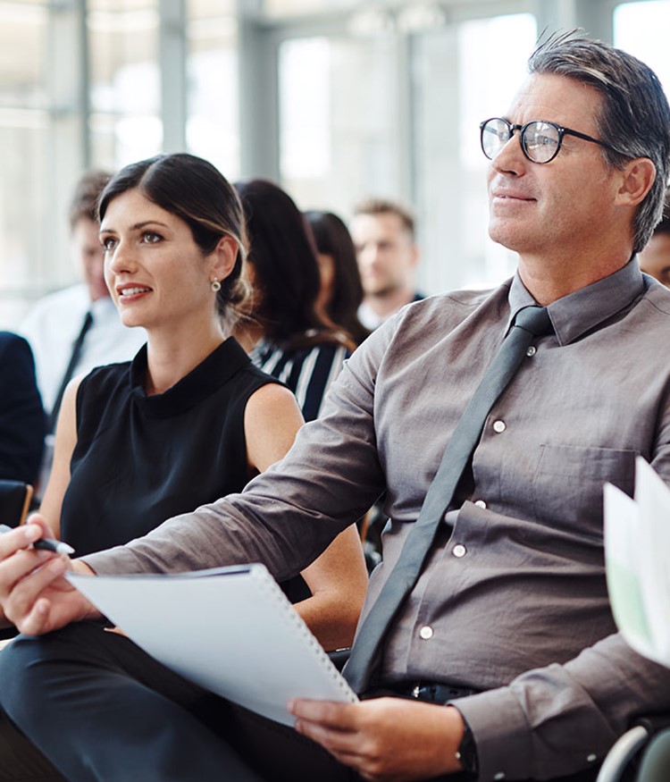 Group Of Businesspeople Attending A Conference