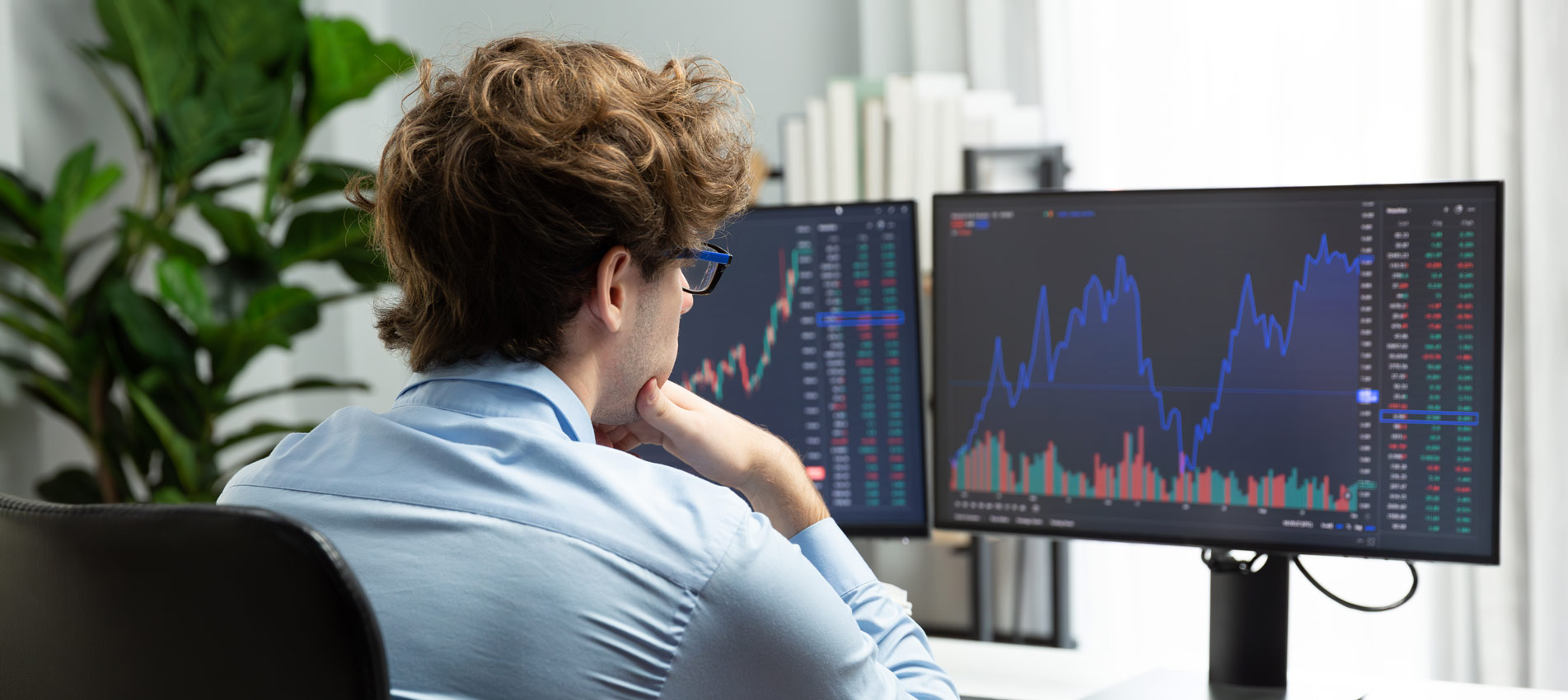 Young Stock Trader Looking On Dynamic Exchange Investment On Pc