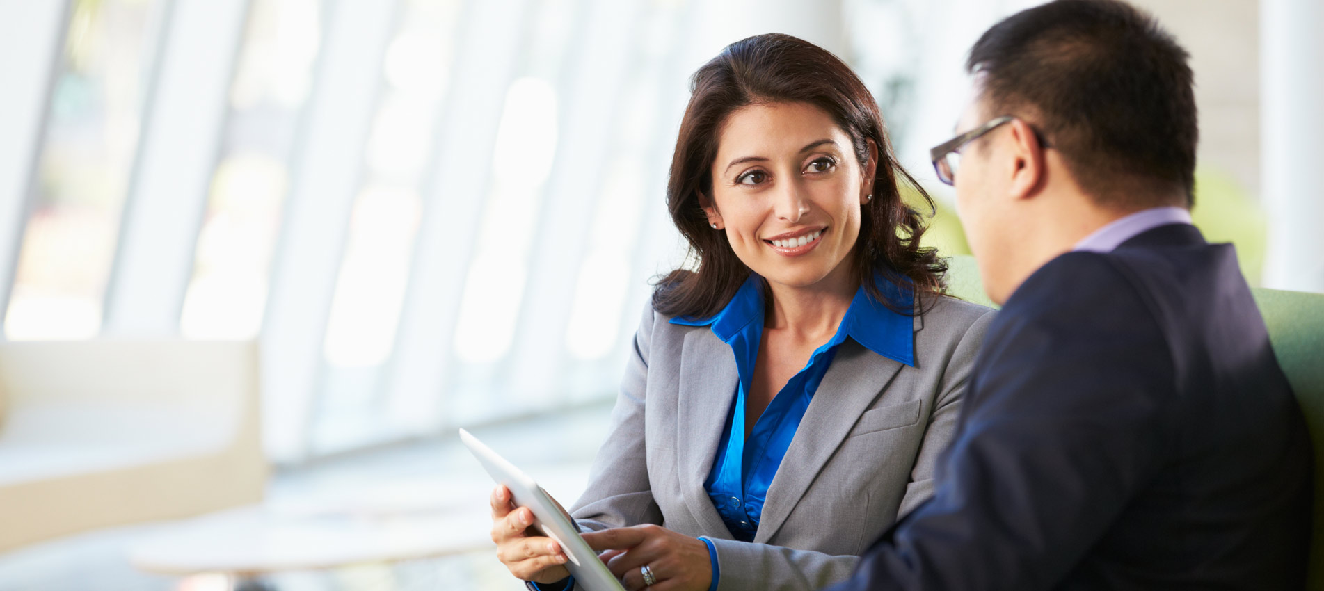 Hispanic Female Investor Meeting With A Client