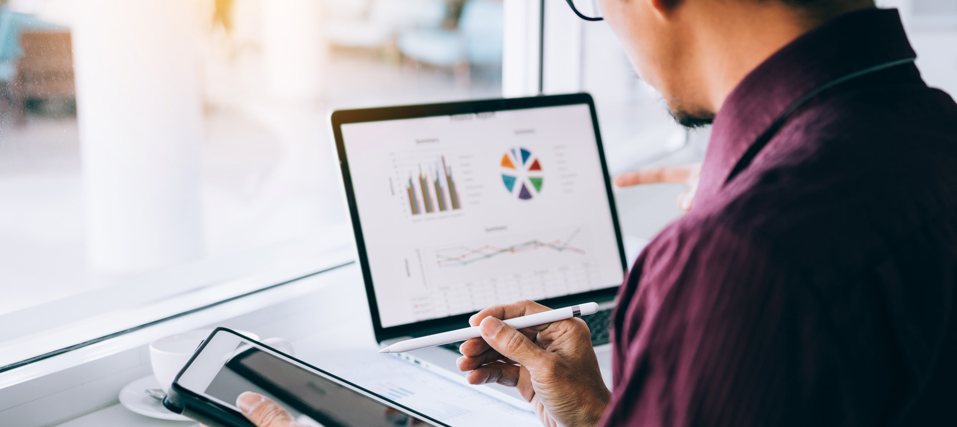 Business Man Reviewing Data On A Screen
