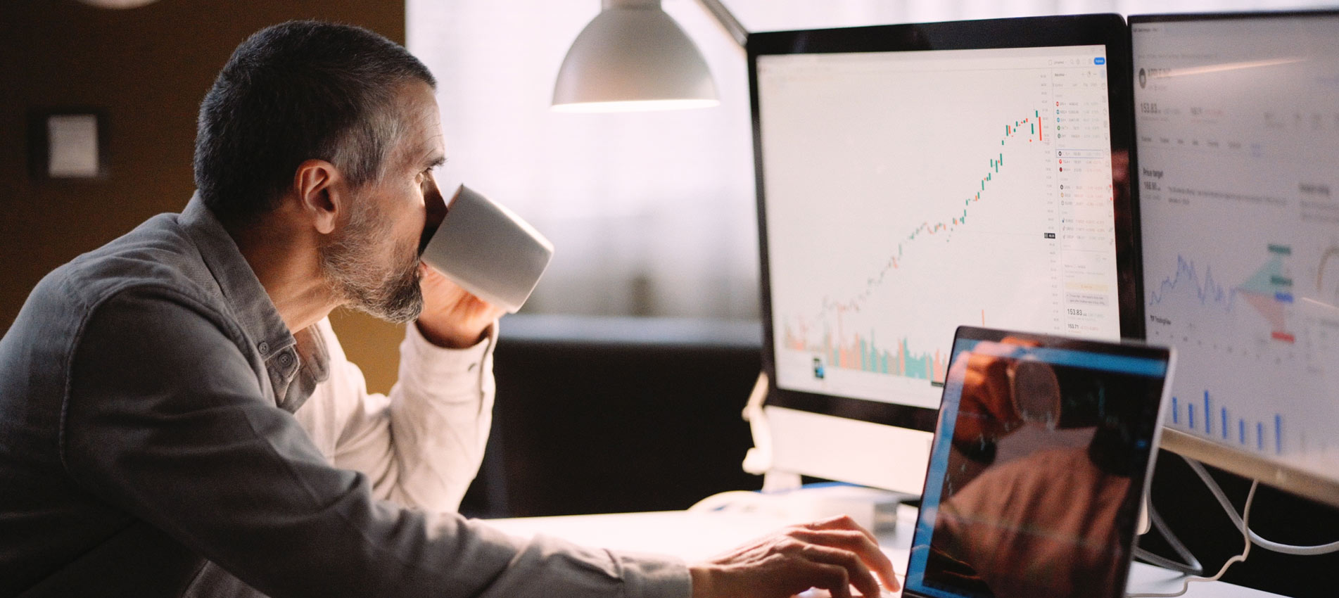 Stock Trader Studying The Stock Market On Screen