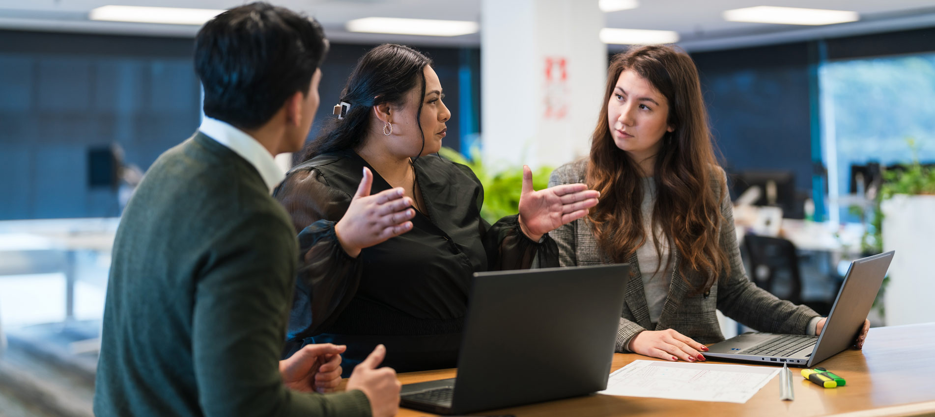 Business Partners Working On The Project In The Office Using Laptop