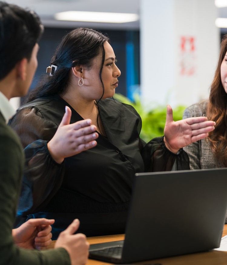 Business Partners Working On The Project In The Office Using Laptop