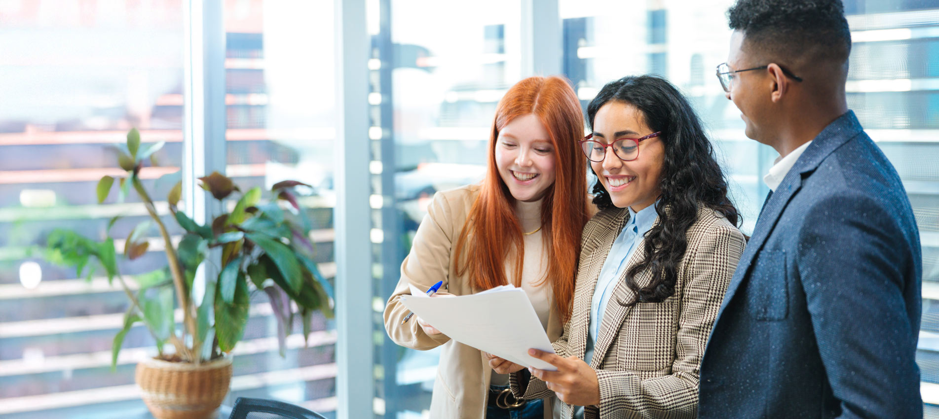 Young Professionals Collaborating On A Project In A Modern Office