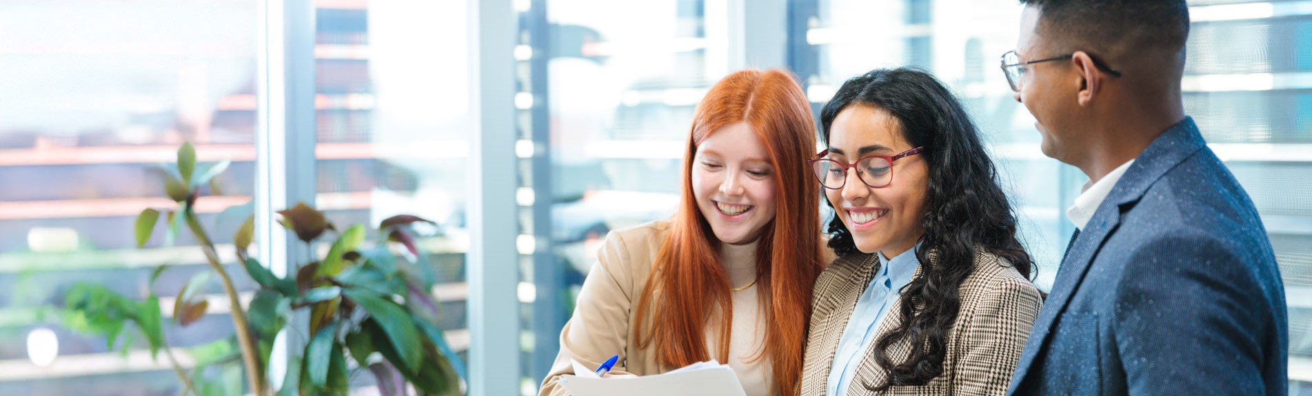 Young Professionals Collaborating On A Project In A Modern Office