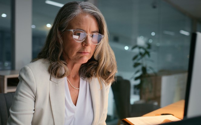 Businesswoman Working At The Office At Night.
