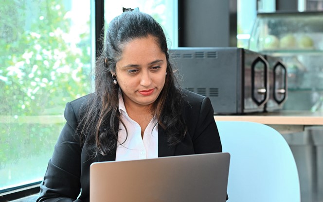 Business Woman Working On Laptop While Siting At A Cafe