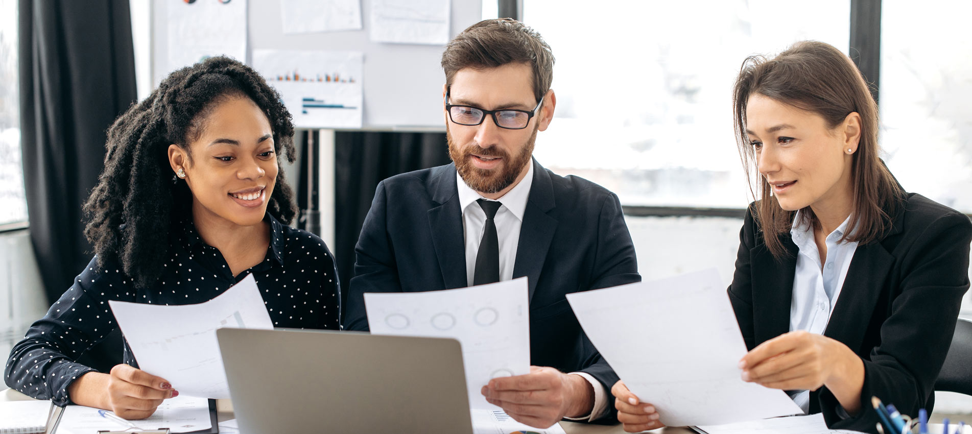 Investment Colleagues Are Analyzing Market Graphs