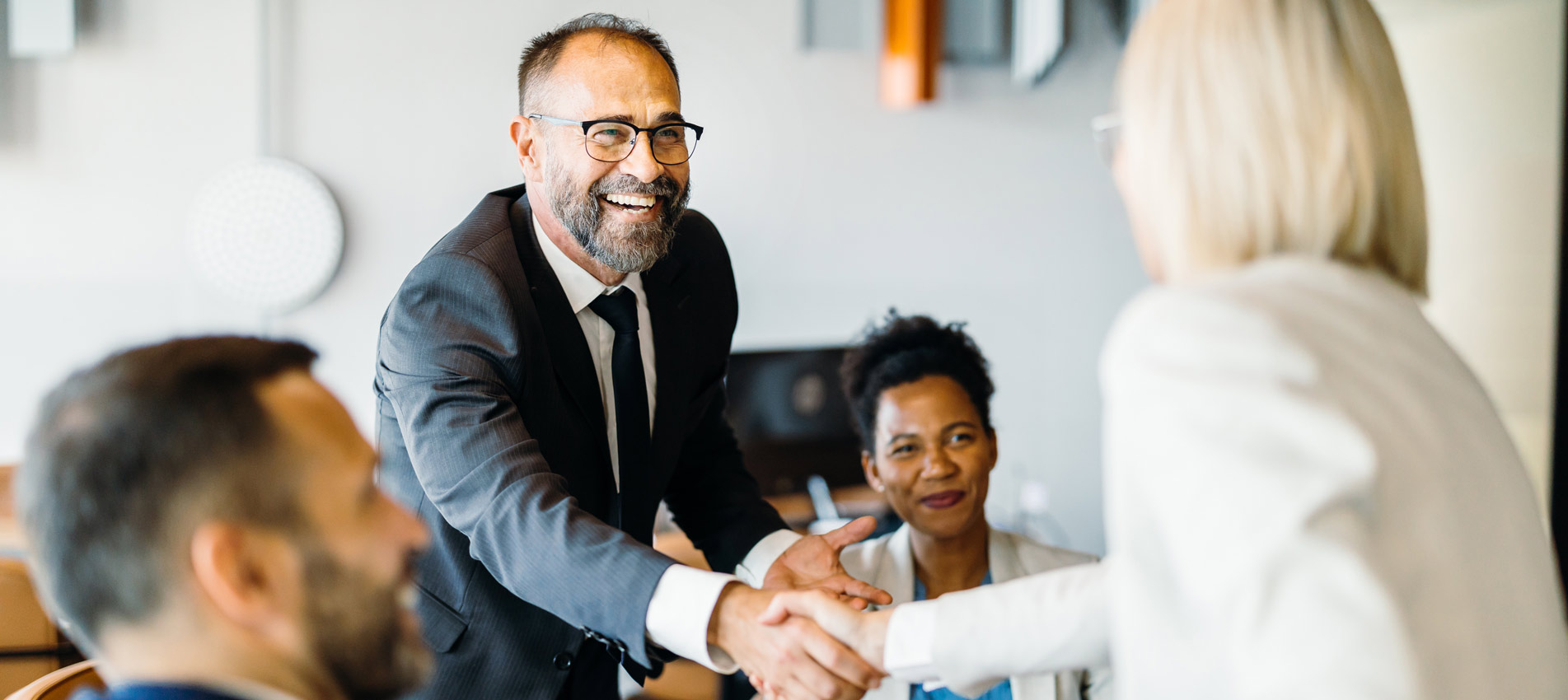 Business Professionals Celebrating An Accomplishment At The Workplace