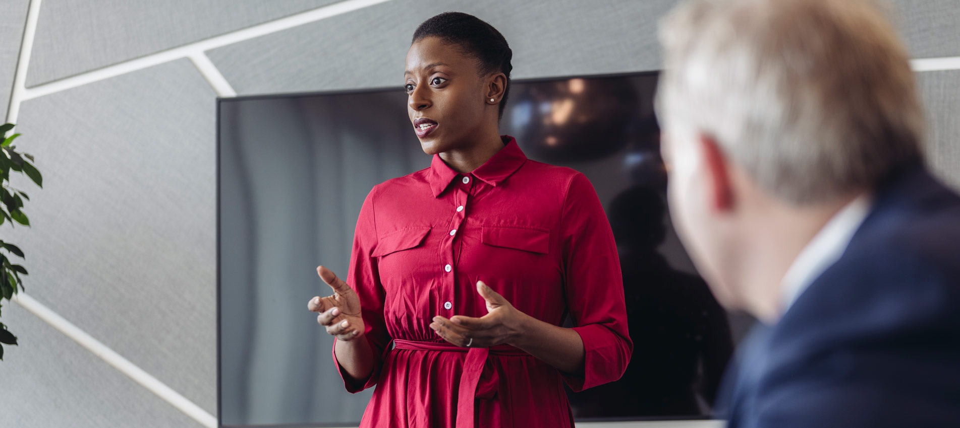 Mid Adult Businesswoman Presenting Ideas To Investment Team