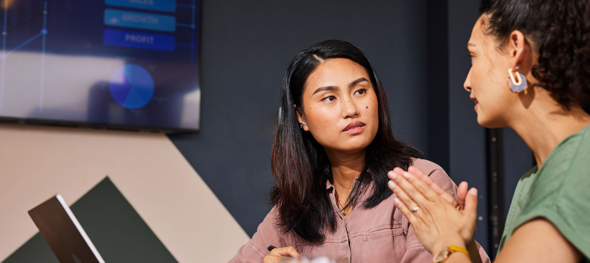 A Female Investor Actively Listening To Her Business Client