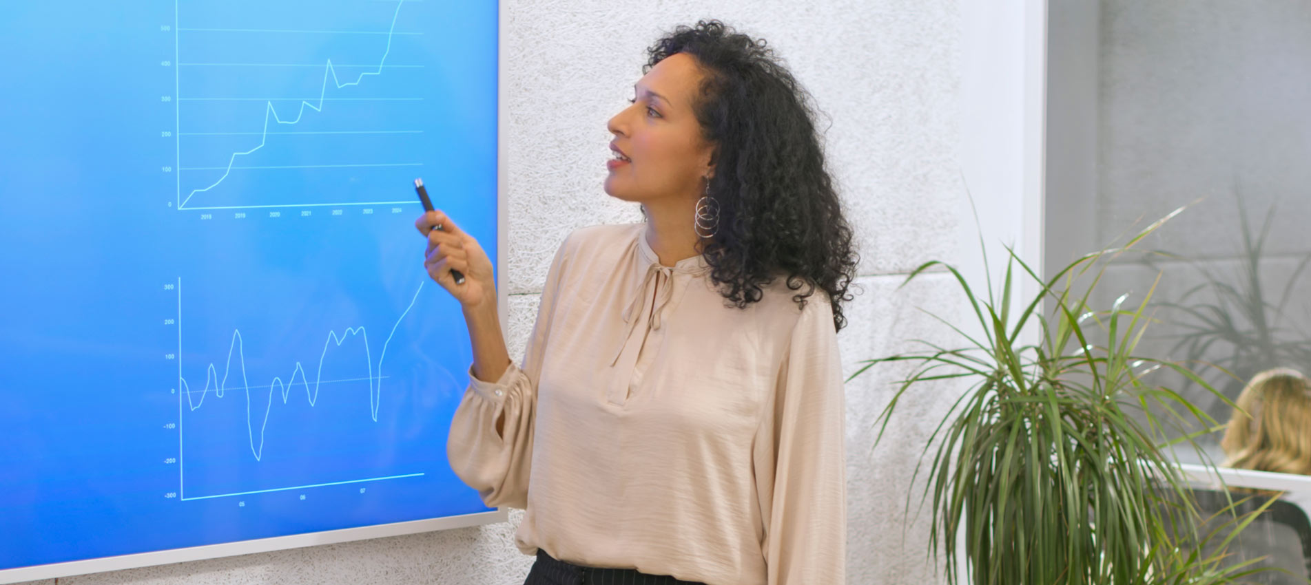 Businesswoman Giving Presentation With Graph