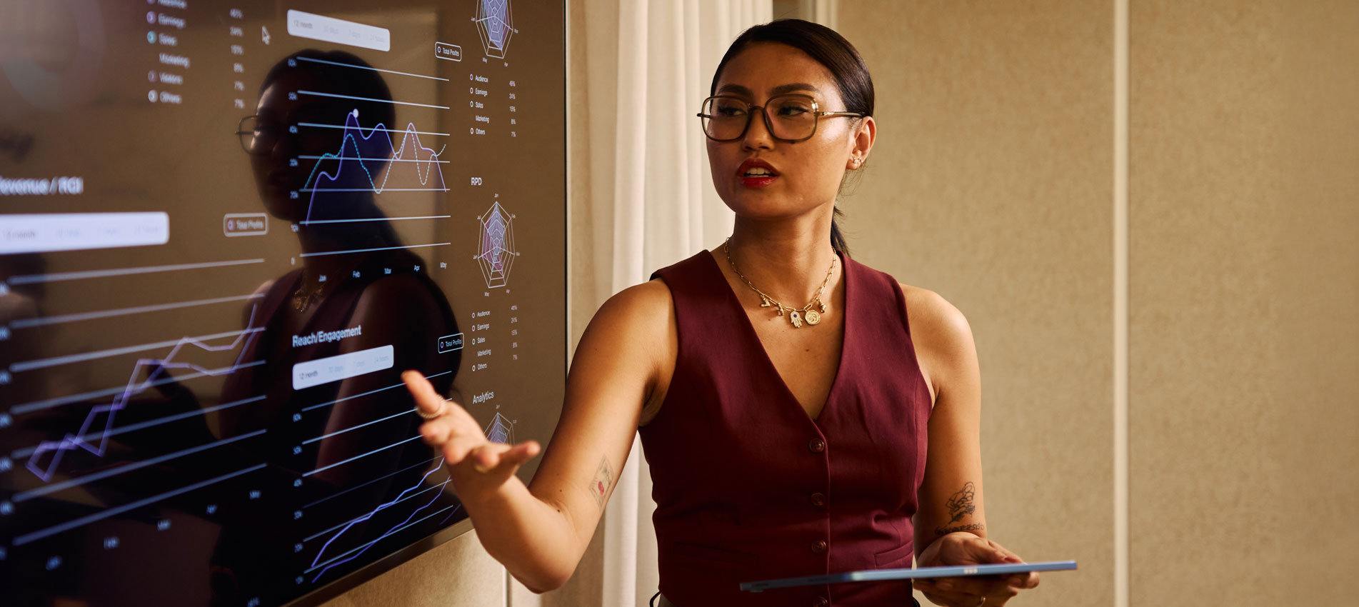 Businesswoman Presenting Data Analytics On Large Screen