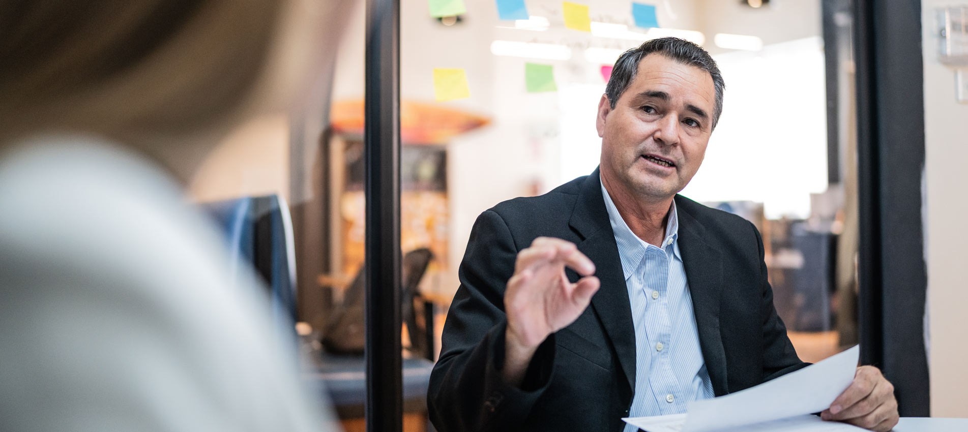 Hispanic Businessman In A Meeting At The Office